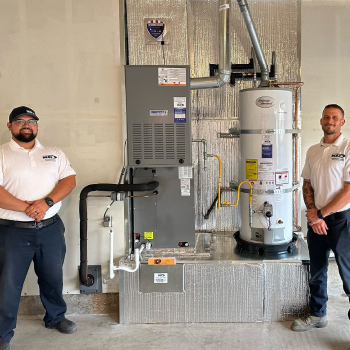 two men by a new furnace and new water heater